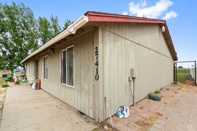 27410 Peckham Rd, Wilder, ID 83676 - view of side of home featuring a patio
