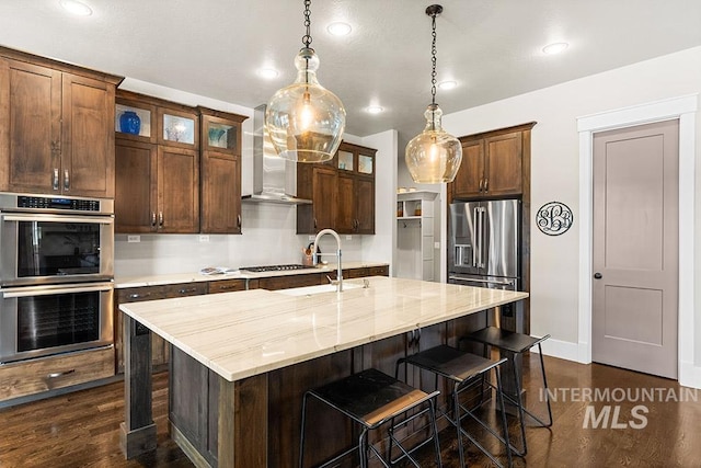 3061 S Fox Run Ave, Eagle, ID 83616 - kitchen with stainless steel appliances, wall chimney exhaust hood, a sink, dark wood-type flooring, and recessed lighting