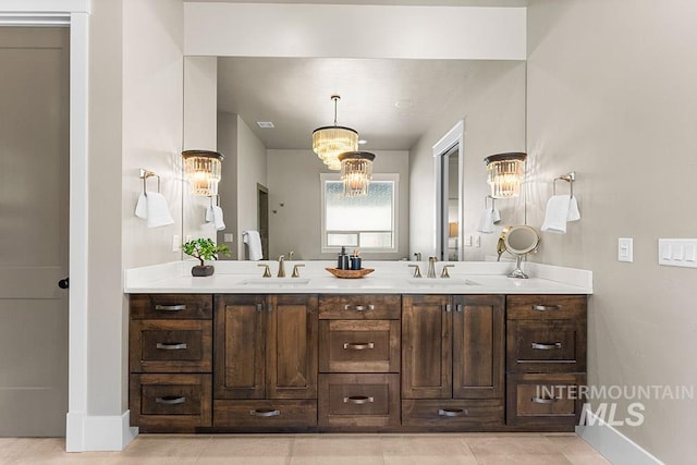 3061 S Fox Run Ave, Eagle, ID 83616 - full bathroom featuring baseboards, double vanity, a chandelier, and tile patterned flooring