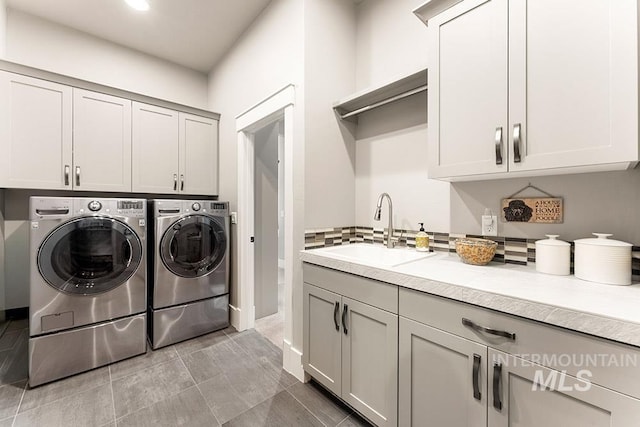 3061 S Fox Run Ave, Eagle, ID 83616 - laundry room featuring washer and clothes dryer, cabinet space, and recessed lighting