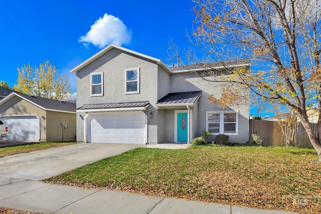 front facade featuring a garage and a front yard