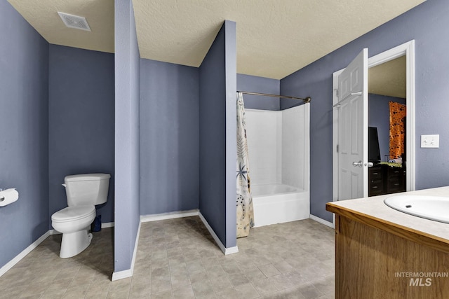 full bathroom with a textured ceiling, vanity, shower / tub combo, and toilet