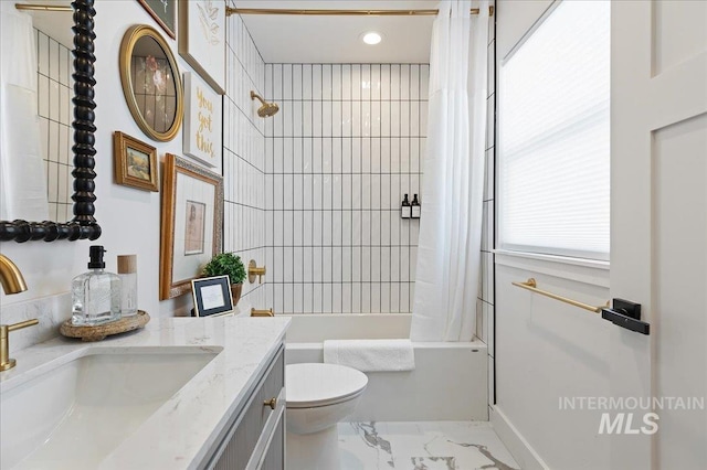 full bathroom featuring vanity, toilet, and shower / bath combo with shower curtain