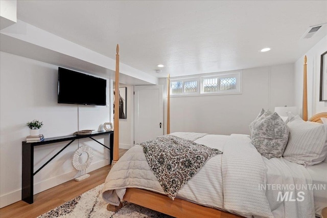 bedroom with light wood-type flooring