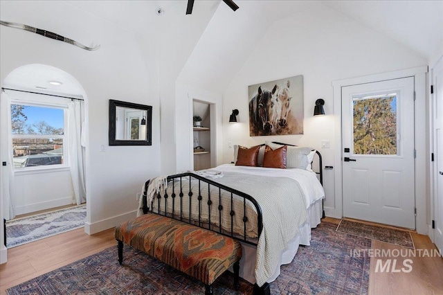 bedroom with lofted ceiling and hardwood / wood-style flooring