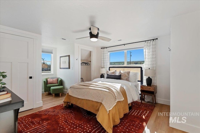 bedroom featuring hardwood / wood-style floors and ceiling fan