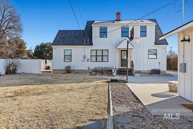 back of property with a patio