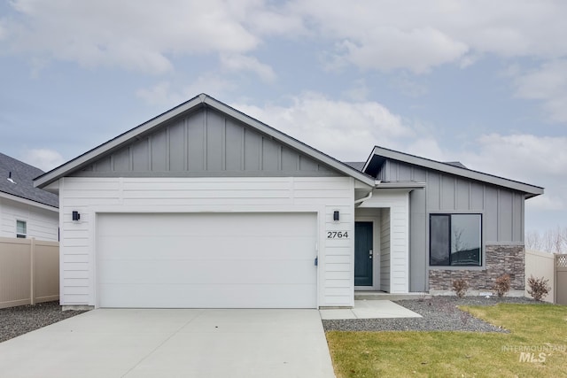 view of front of house with a garage and a front lawn