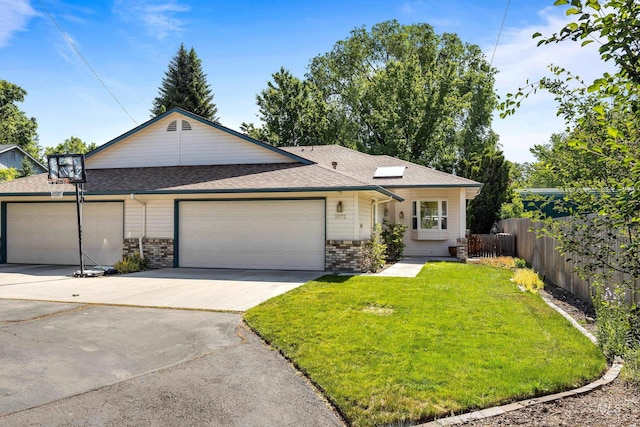 2072 N 28th St, Boise, ID 83702 - view of front of house featuring a garage, concrete driveway, roof with shingles, and brick siding