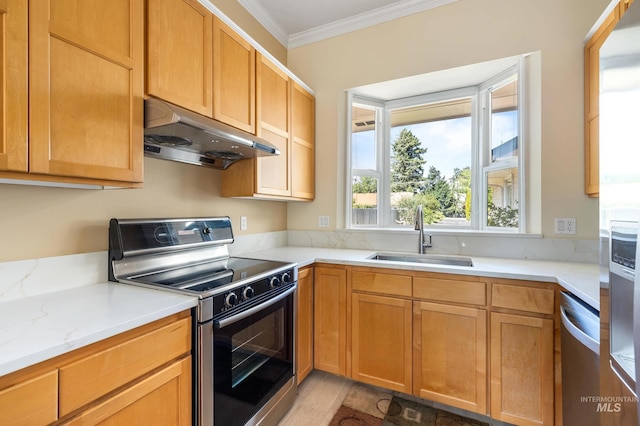 2072 N 28th St, Boise, ID 83702 - kitchen with appliances with stainless steel finishes, under cabinet range hood, a sink, ornamental molding, and light stone countertops