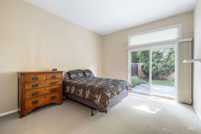 2072 N 28th St, Boise, ID 83702 - bedroom with light colored carpet, access to exterior, and baseboards