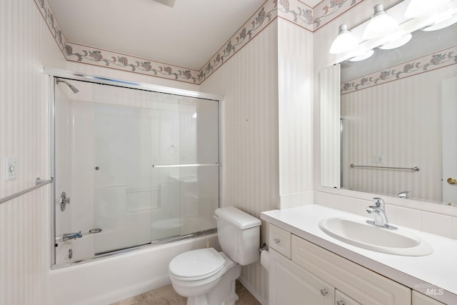 2072 N 28th St, Boise, ID 83702 - full bath with wallpapered walls, toilet, vanity, and combined bath / shower with glass door