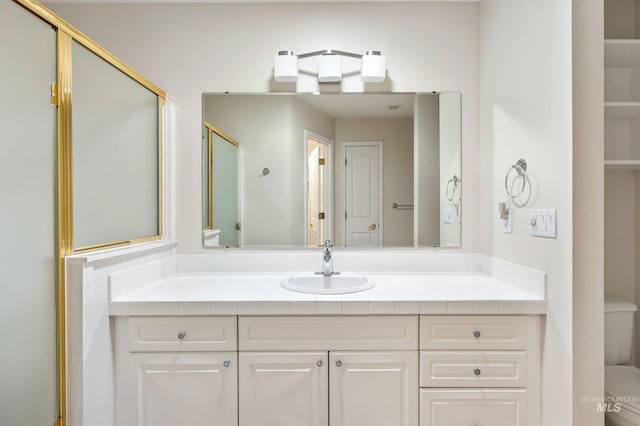2072 N 28th St, Boise, ID 83702 - full bathroom featuring toilet, vanity, and an enclosed shower