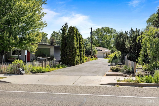 2072 N 28th St, Boise, ID 83702 - view of property hidden behind natural elements featuring a detached garage
