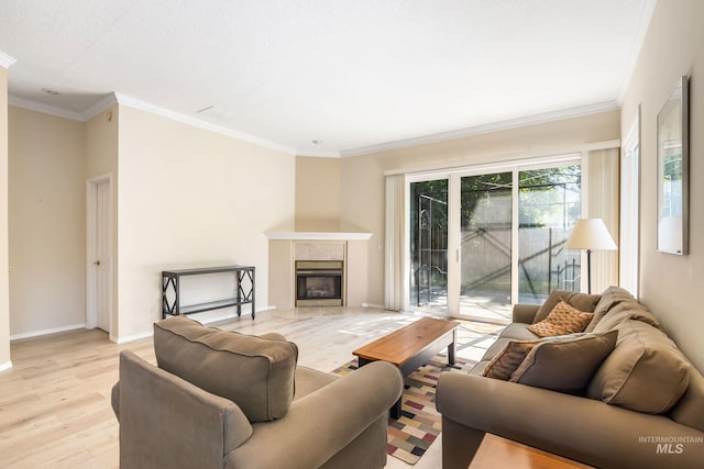 2072 N 28th St, Boise, ID 83702 - living area featuring light wood-style floors, a fireplace, crown molding, and baseboards