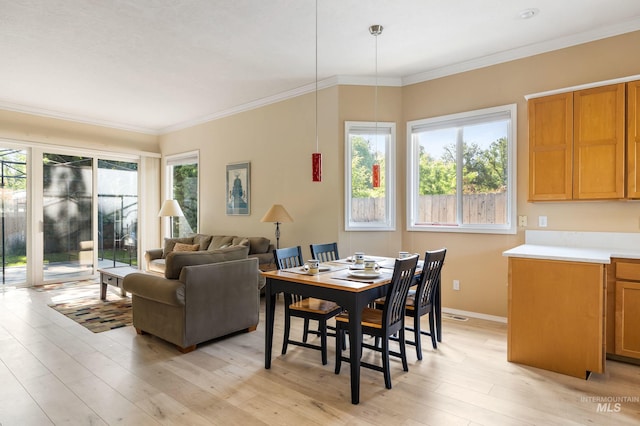 2072 N 28th St, Boise, ID 83702 - dining space featuring plenty of natural light, light wood finished floors, ornamental molding, and baseboards