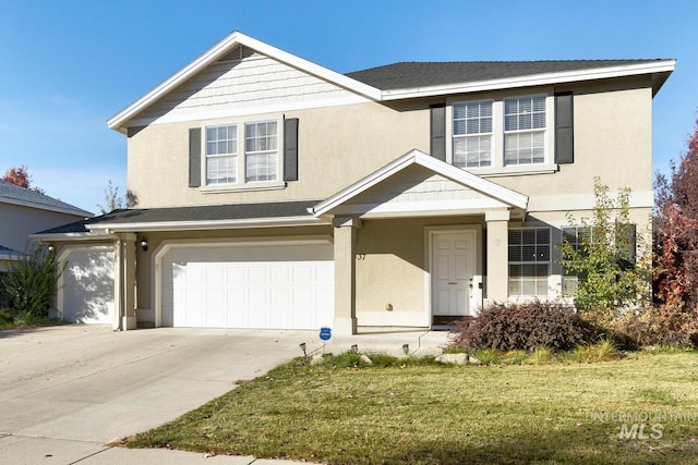 front of property with a front lawn and a garage