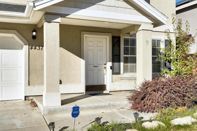 property entrance featuring covered porch