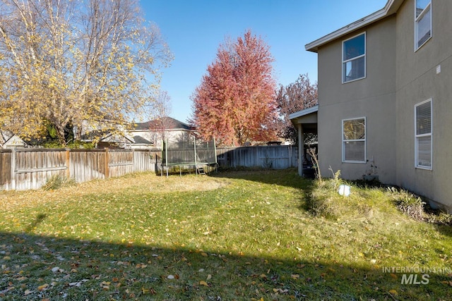 view of yard with a trampoline