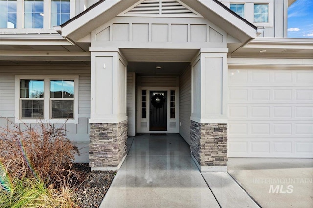 entrance to property featuring a garage