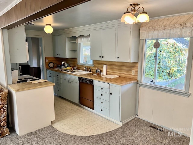 kitchen with dishwasher, a chandelier, decorative backsplash, white cabinets, and sink