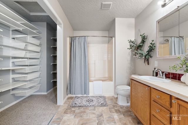 bathroom featuring shower / tub combo, visible vents, toilet, a textured ceiling, and vanity