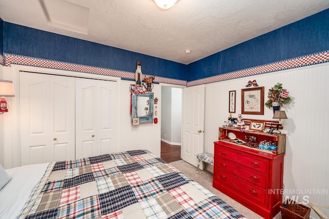 bedroom with a closet and a textured ceiling