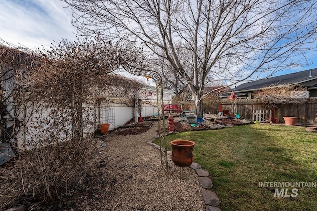 view of yard with a fenced backyard