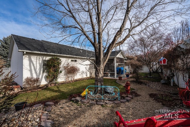 view of yard with a sunroom