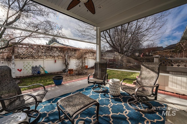 view of patio / terrace with a fenced backyard and ceiling fan