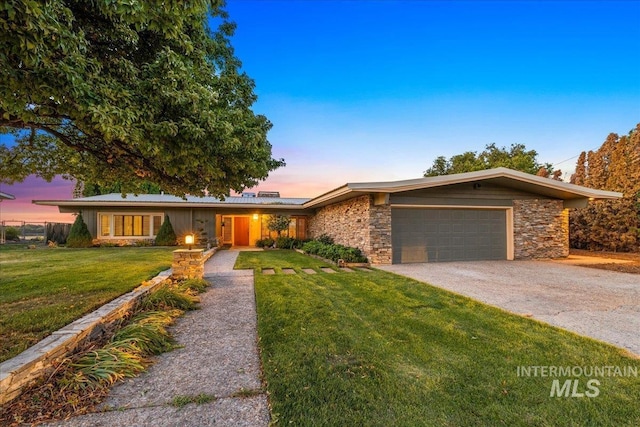 2401 Terrace Dr, Caldwell, ID 83605 - mid-century modern home with stone siding, gravel driveway, a front yard, and an attached garage