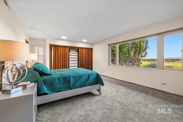 2401 Terrace Dr, Caldwell, ID 83605 - carpeted bedroom featuring a textured ceiling and recessed lighting