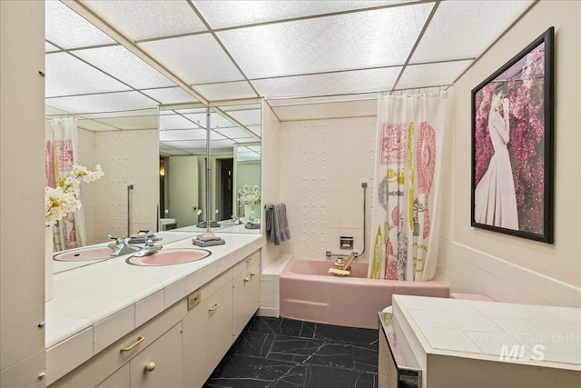 2401 Terrace Dr, Caldwell, ID 83605 - bathroom with a paneled ceiling, vanity, shower / bath combo with shower curtain, and marble look tiles