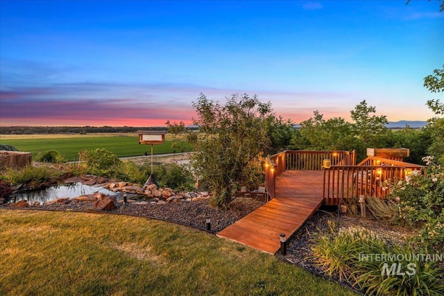 2401 Terrace Dr, Caldwell, ID 83605 - yard at dusk with a yard and a wooden deck