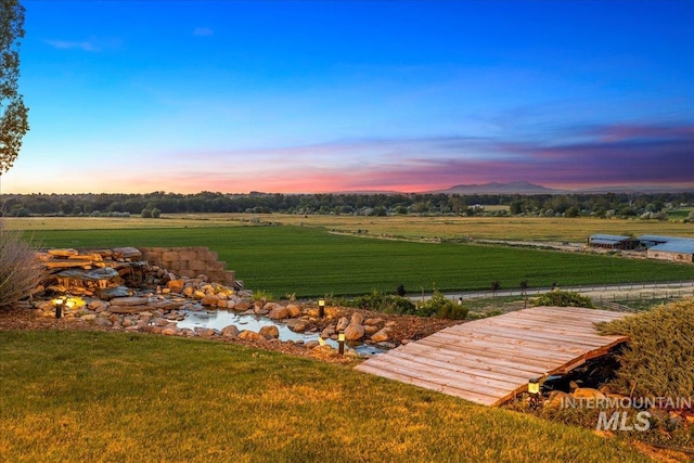 2401 Terrace Dr, Caldwell, ID 83605 - yard at dusk with a lawn and a view of rural / pastoral area