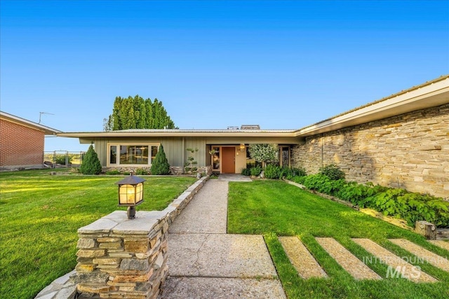 2401 Terrace Dr, Caldwell, ID 83605 - view of front of property featuring a front yard and stone siding