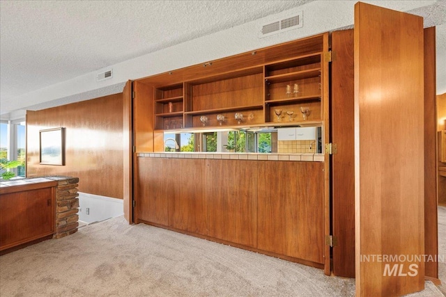 2401 Terrace Dr, Caldwell, ID 83605 - bar area with light carpet and a textured ceiling