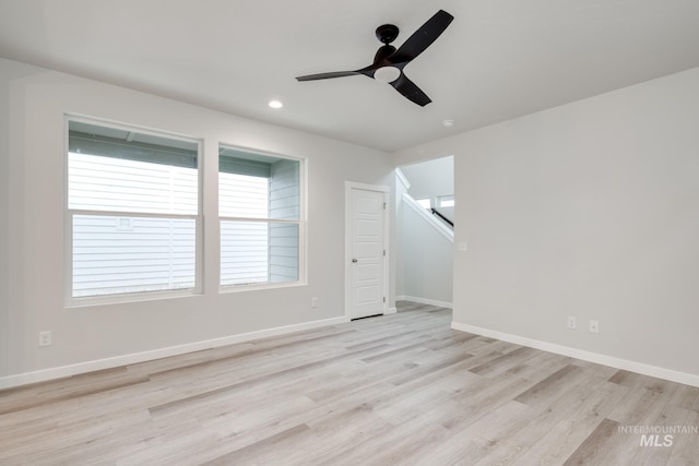 additional living space with light wood finished floors, a wealth of natural light, a ceiling fan, and recessed lighting