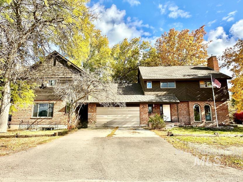 front of property with a garage