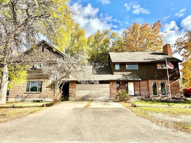 front of property with a garage