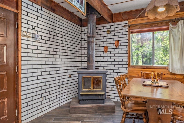 details featuring wood finished floors and a wood stove