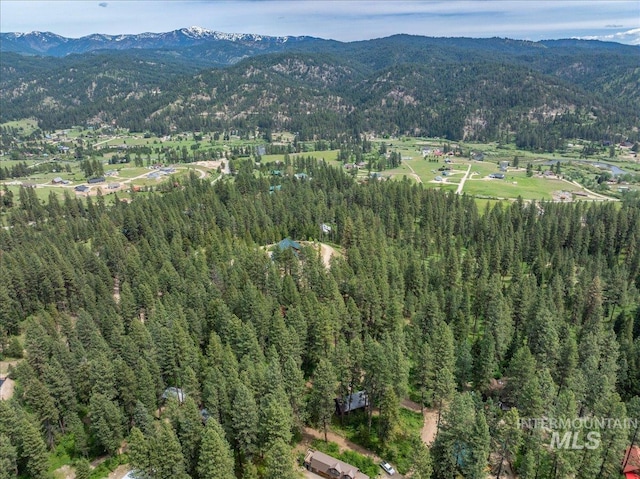 bird's eye view featuring a view of trees and a mountain view
