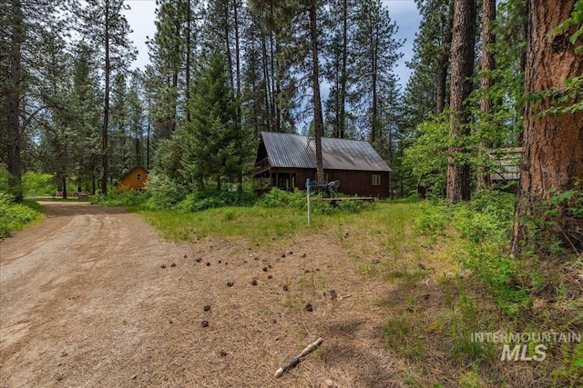 view of yard featuring a view of trees