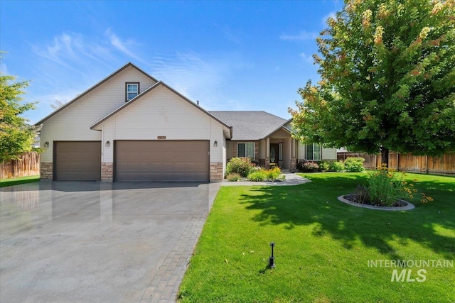 3314 S Raintree, Nampa, ID 83669 - view of front of home featuring an attached garage, driveway, and stone siding