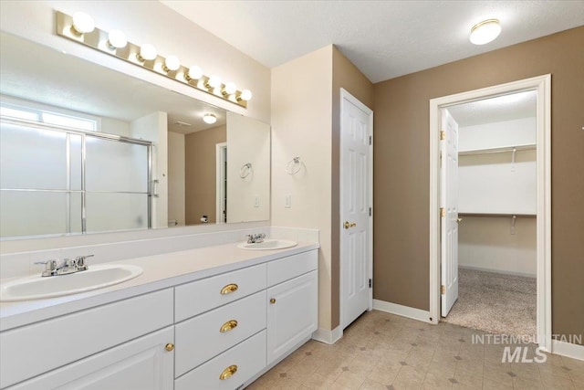3314 S Raintree, Nampa, ID 83669 - full bath with double vanity, an enclosed shower, and a spacious closet