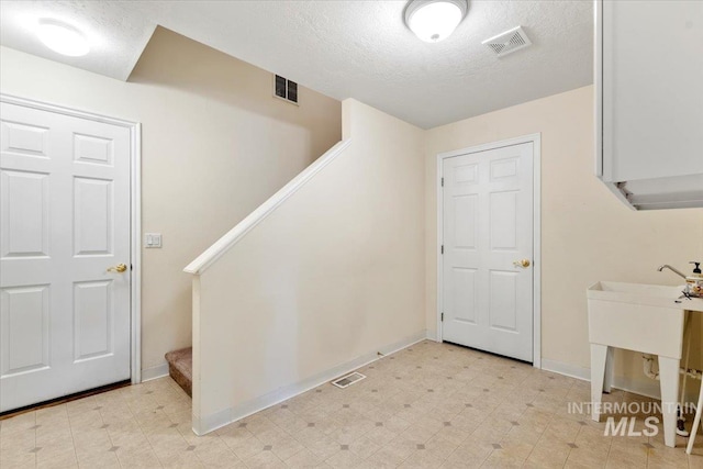 3314 S Raintree, Nampa, ID 83669 - staircase featuring a textured ceiling and tile patterned floors