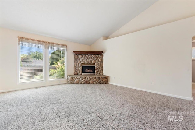 3314 S Raintree, Nampa, ID 83669 - unfurnished living room featuring carpet flooring, vaulted ceiling, and a fireplace