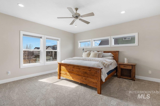 carpeted bedroom featuring recessed lighting, a ceiling fan, and baseboards