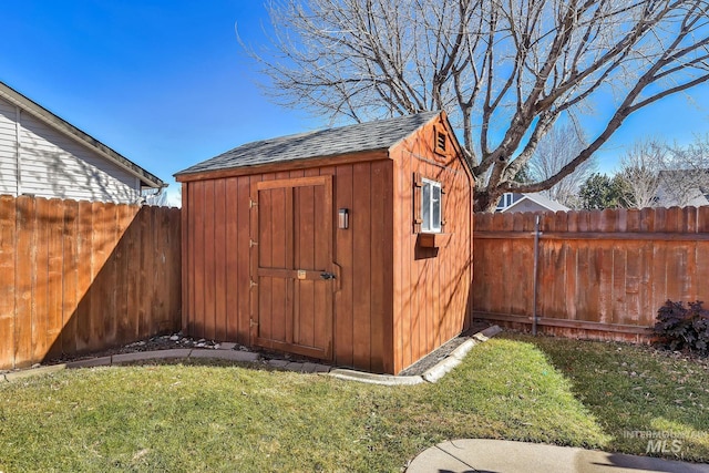 view of shed featuring a fenced backyard