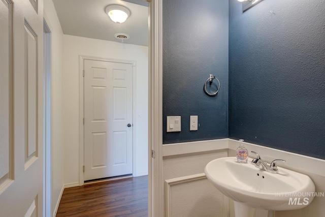 4935 N Rathbone Ave, Meridian, ID 83646 - bathroom with a sink and wood finished floors